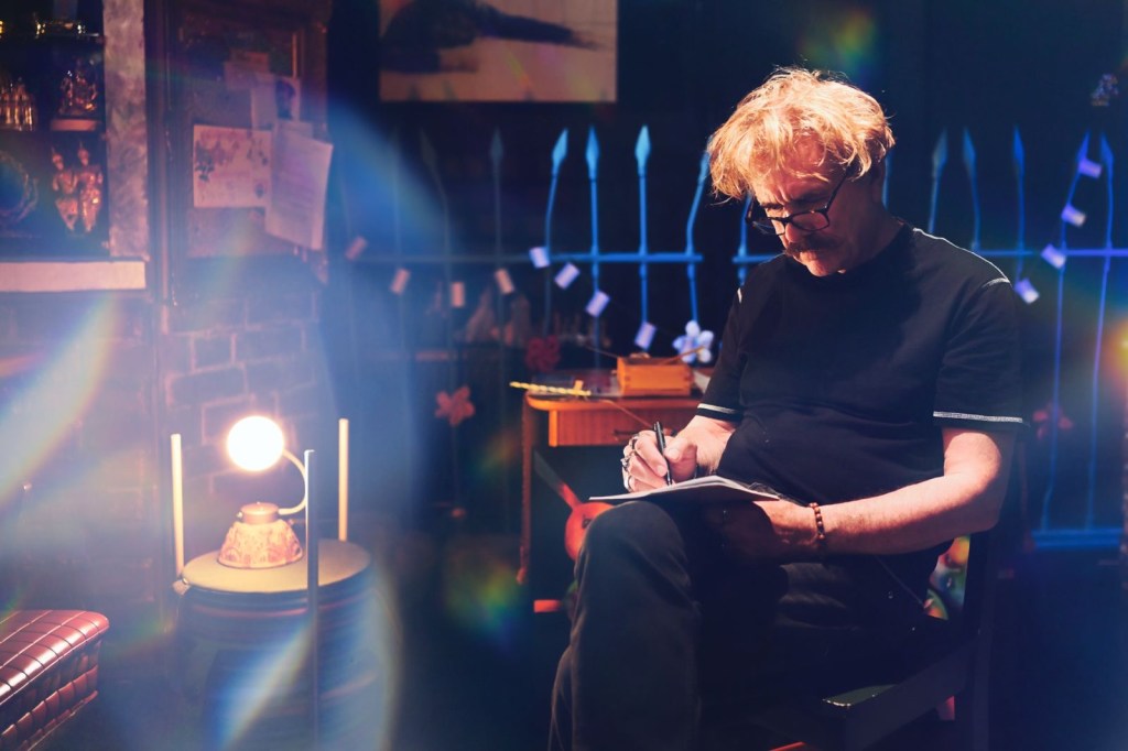 Allan writing in a notebook